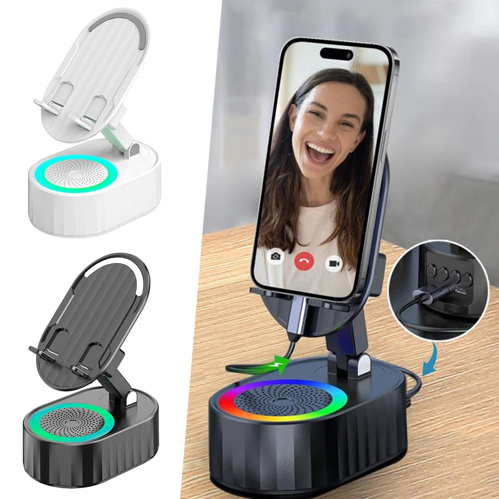 Phone stand with RGB lighting and speaker on a wooden surface, showing a phone screen with a video call.