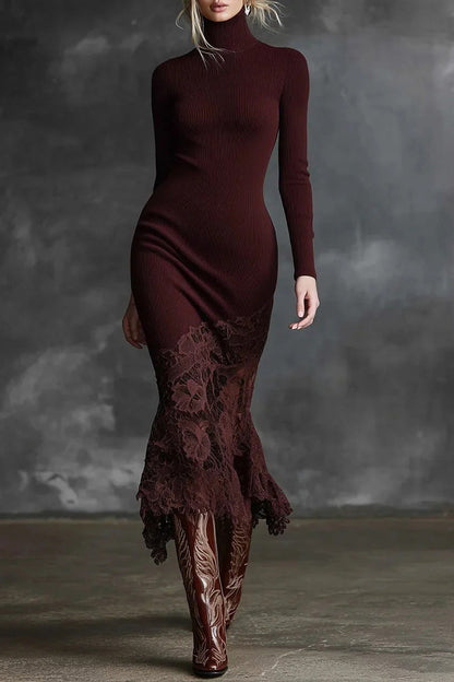 Woman wearing a burgundy dress with lace detailing and matching boots against a gray background
